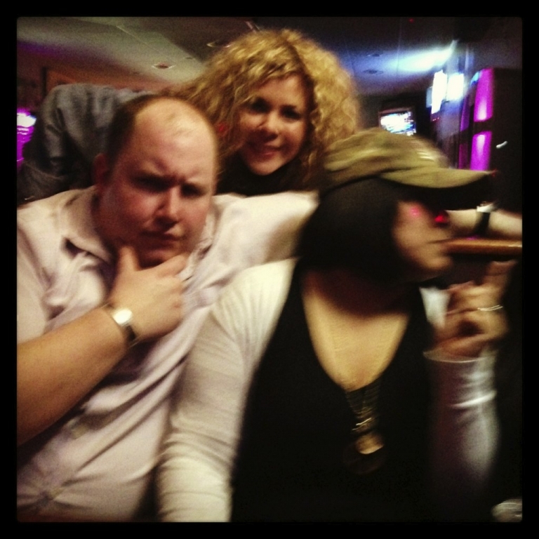 no that is not a cigar...it's the booth.  that's the finger of sass...and her bodyguard.